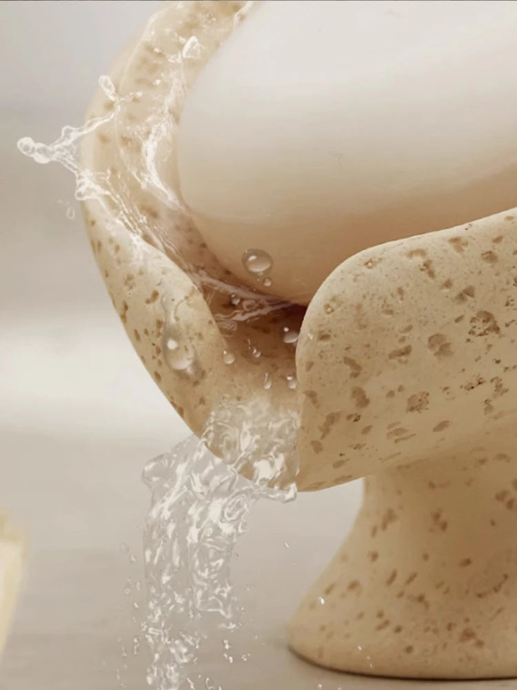Close-up of a ceramic egg holder with water flowing over it